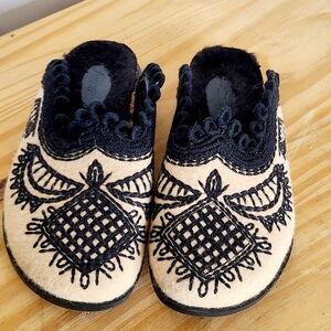 Chic Black and Cream Women's Embroidered Slides By FREE PEOPLE.